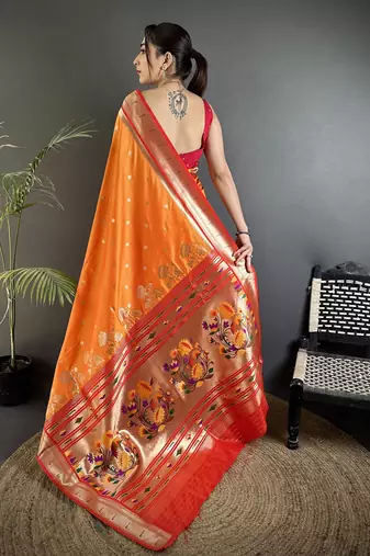 Women orange   floral motifs lichi silk saree
