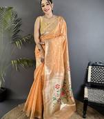 Women peach parrot & floral woven design tissue saree