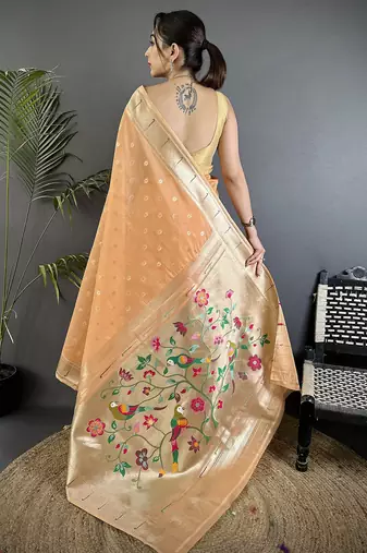 Women peach parrot & floral woven design tissue saree