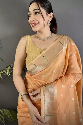 Women peach parrot & floral woven design tissue saree