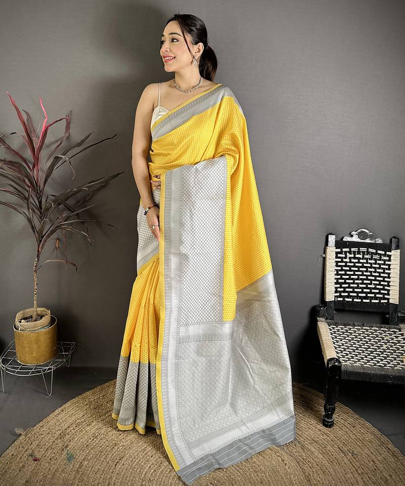 Women yellow intricate geometric soft silk saree