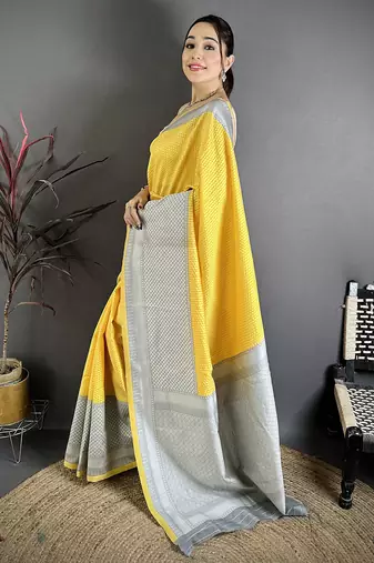 Women yellow intricate geometric soft silk saree