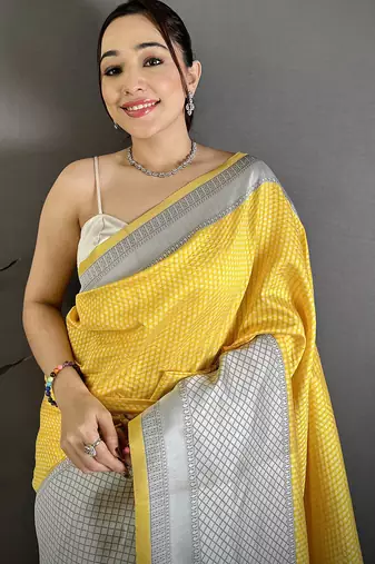Women yellow intricate geometric soft silk saree