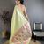 Women light green solid tissue saree