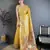 Women golden yellow solid tissue saree