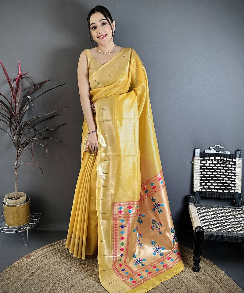 Women golden yellow solid tissue saree