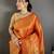 Women orange checked & floral motifs banarasi soft silk saree