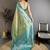 Women teal green floral design  with  copper motifs tissue silk saree