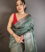 Women green zari woven ethnic motifs banarasi silk saree