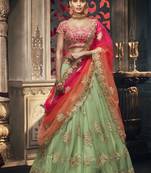 Soft Premium Net Wedding Lehenga In Green With Embroidery & Crystal Stone Work