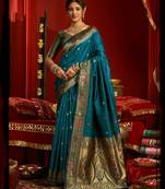 Women dark teal floral motifs silk blend saree