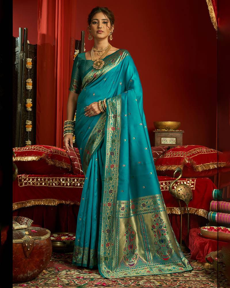Women aqua blue floral motifs silk blend saree