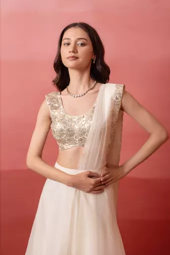 white pre-draped skirt saree with sequin blouse