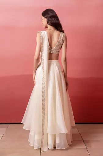 white pre-draped skirt saree with sequin blouse