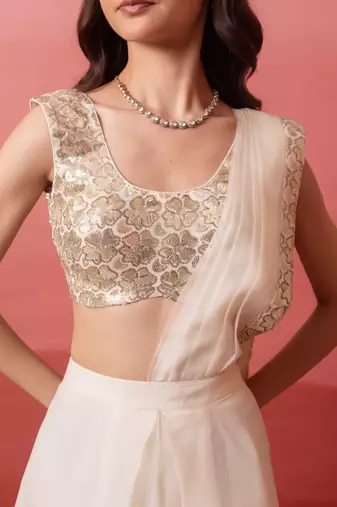 white pre-draped skirt saree with sequin blouse
