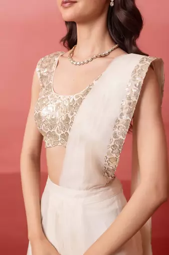 white pre-draped skirt saree with sequin blouse