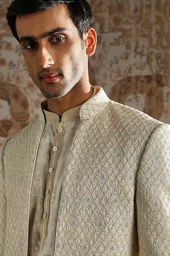 white embroidered silk bandhgala set for men