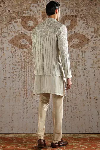white embroidered raw silk bandhgala set for men