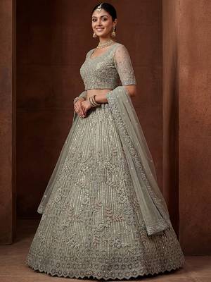 lavish green dori embroidered net wedding wear lehenga choli 2