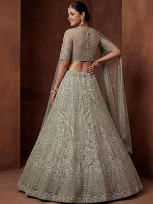 lavish green dori embroidered net wedding wear lehenga choli 4
