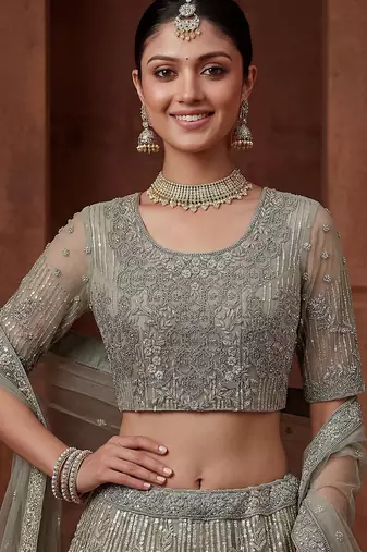 lavish green dori embroidered net wedding wear lehenga choli