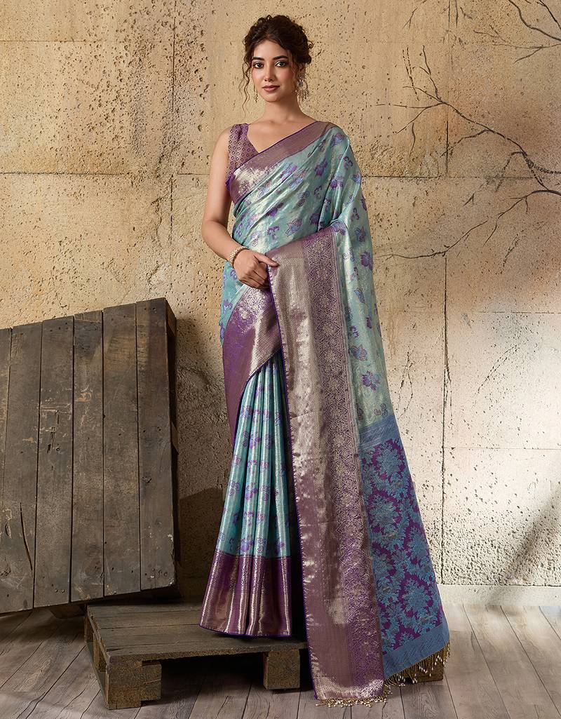 Women's sky blue silk blend saree with rich zari woven design and traditional border with unstiched blouse piece