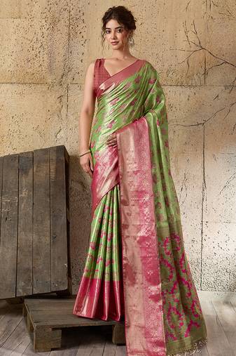 Women's green silk blend saree with rich zari woven design and traditional border with unstiched blouse piece