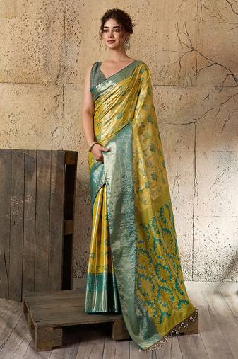 Women's lemon yellow silk blend saree with rich zari woven design and traditional border with unstiched blouse piece
