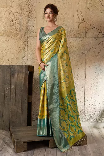 Women's lemon yellow silk blend saree with rich zari woven design and traditional border with unstiched blouse piece