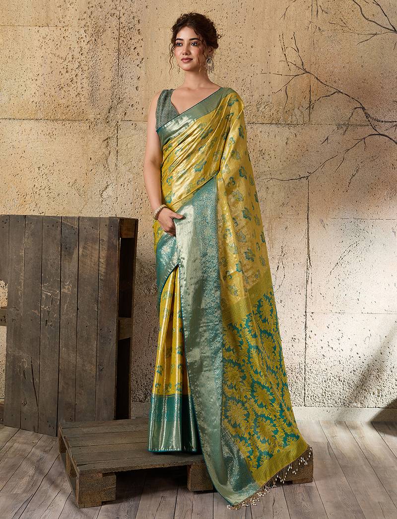 Women's lemon yellow silk blend saree with rich zari woven design and traditional border with unstiched blouse piece