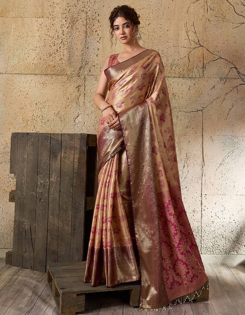 Women's gold silk blend saree with rich zari woven design and traditional border with unstiched blouse piece