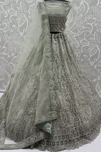 lavish green dori embroidered net wedding wear lehenga choli