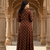 Ftdiva women's long flared rayon printed anarkali kurta in brown.