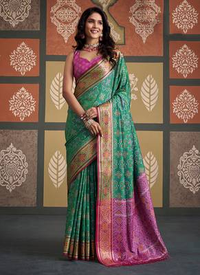Green patola silk blend party wear saree 1