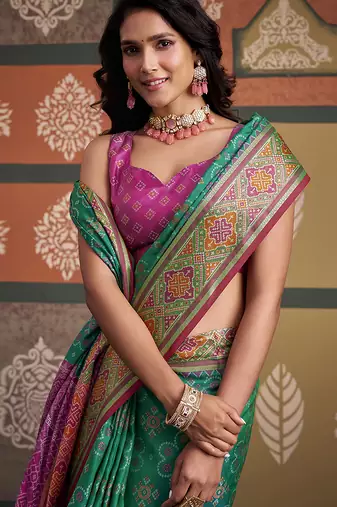 Green patola silk blend party wear saree
