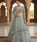 GREEN SOFT NET  EMBROIDERY SEMI STICHED  LEHENGA WHIT BLOUSE