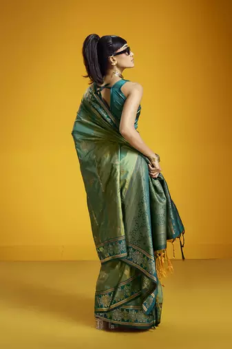 Green handloom silk blend saree with weaving work