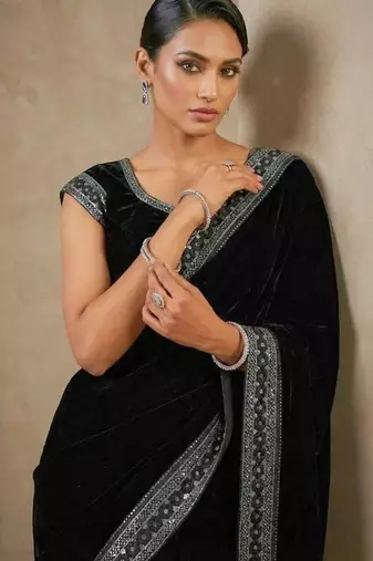 Black bloue piece with embroidred velvet saree