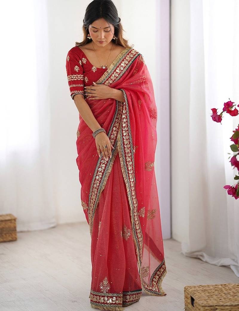 Red embroidered blouse with embroidered saree