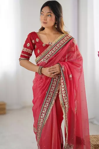 Red embroidered blouse with embroidered saree