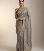 Beige embellished saree with embellished blouse