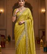 Yellow embellished saree with embellished blouse