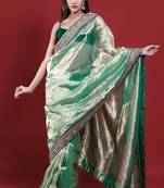 Green embroidered blouse with embroidered saree