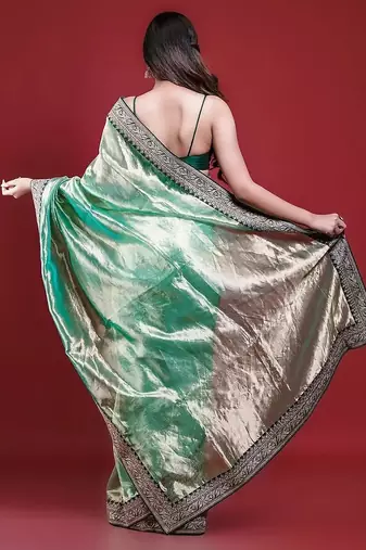 Green embroidered blouse with embroidered saree