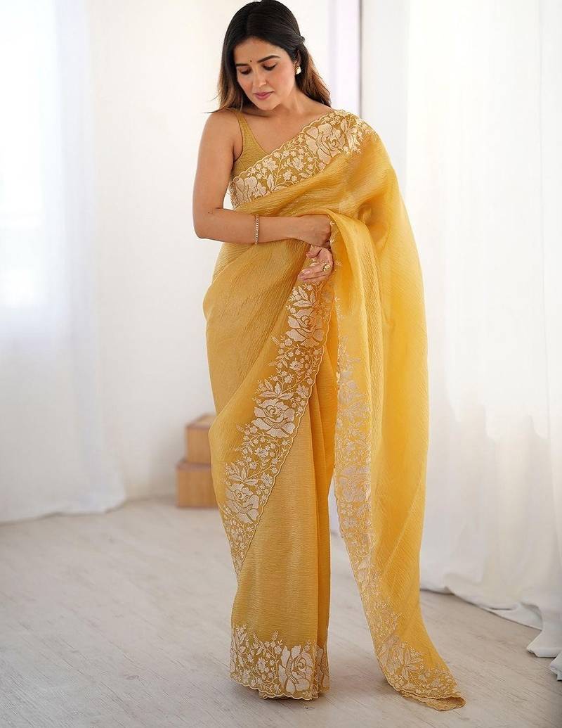 Yelllow embroidered blouse with embroidered saree