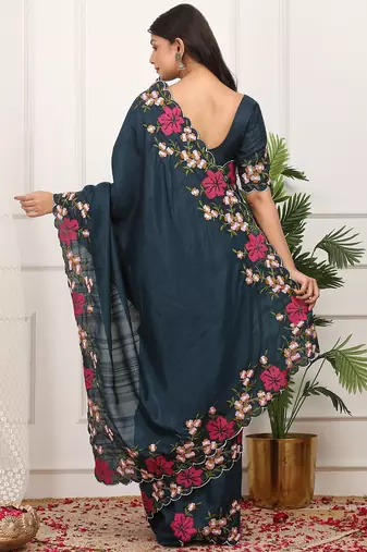 Teal embroidered blouse with embroidered saree