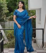Teal embroidered blouse with embroidered saree