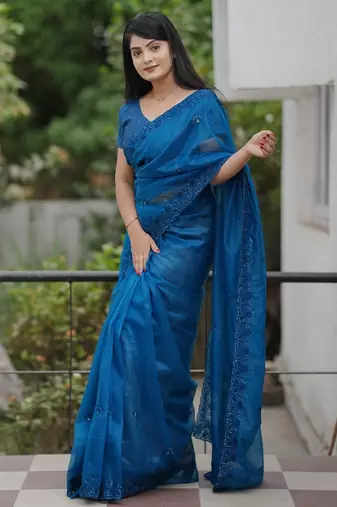 Teal embroidered blouse with embroidered saree