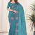 Teal embroidered blouse with embroidered saree