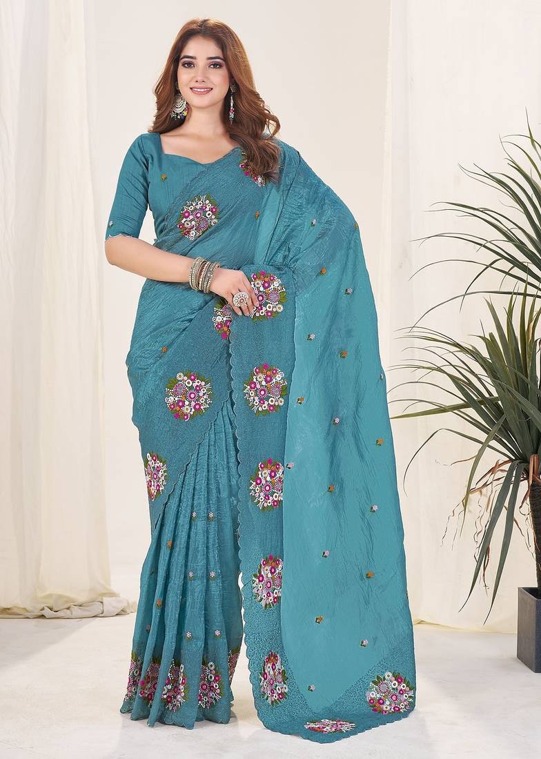 Teal embroidered blouse with embroidered saree